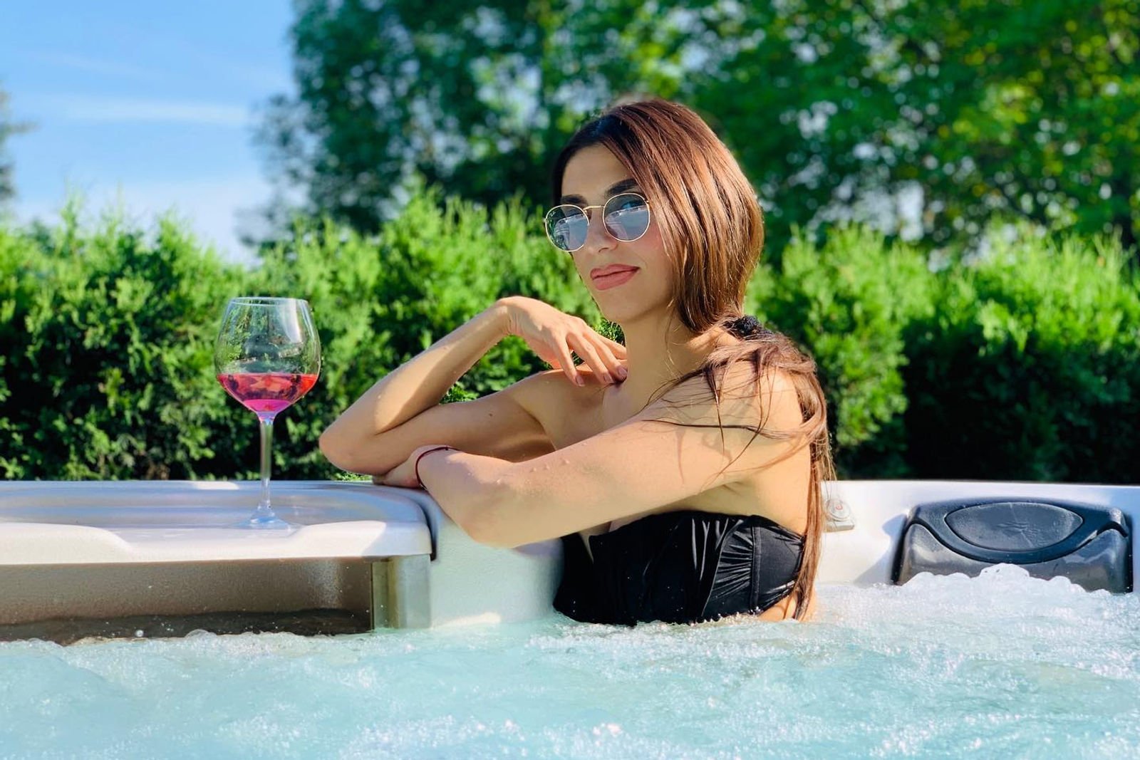 Guest unwinding in the outdoor hot tub at Villa Mukinja